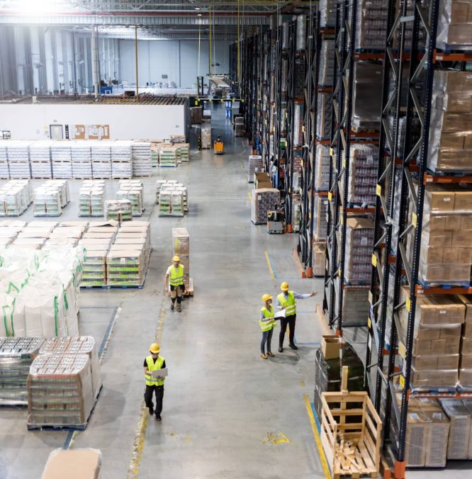 Workers during work in warehouse, view from above