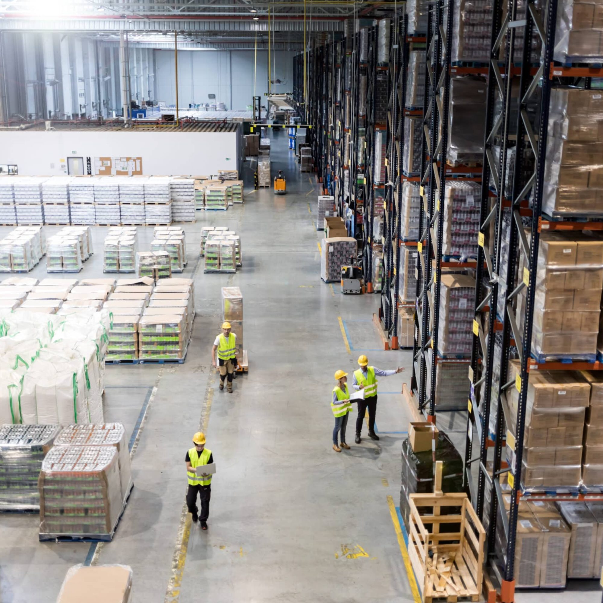 Workers during work in warehouse, view from above